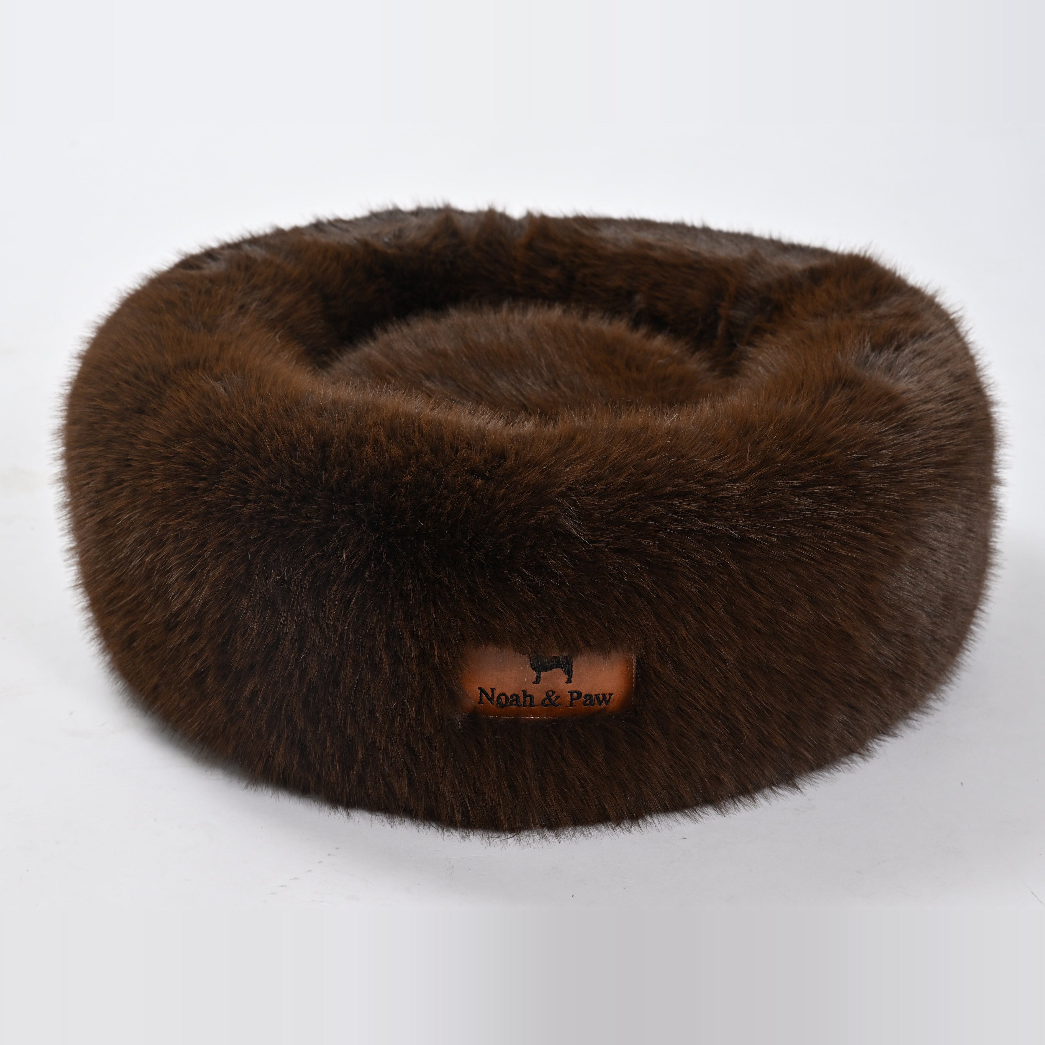 Brown donut dog bed side view