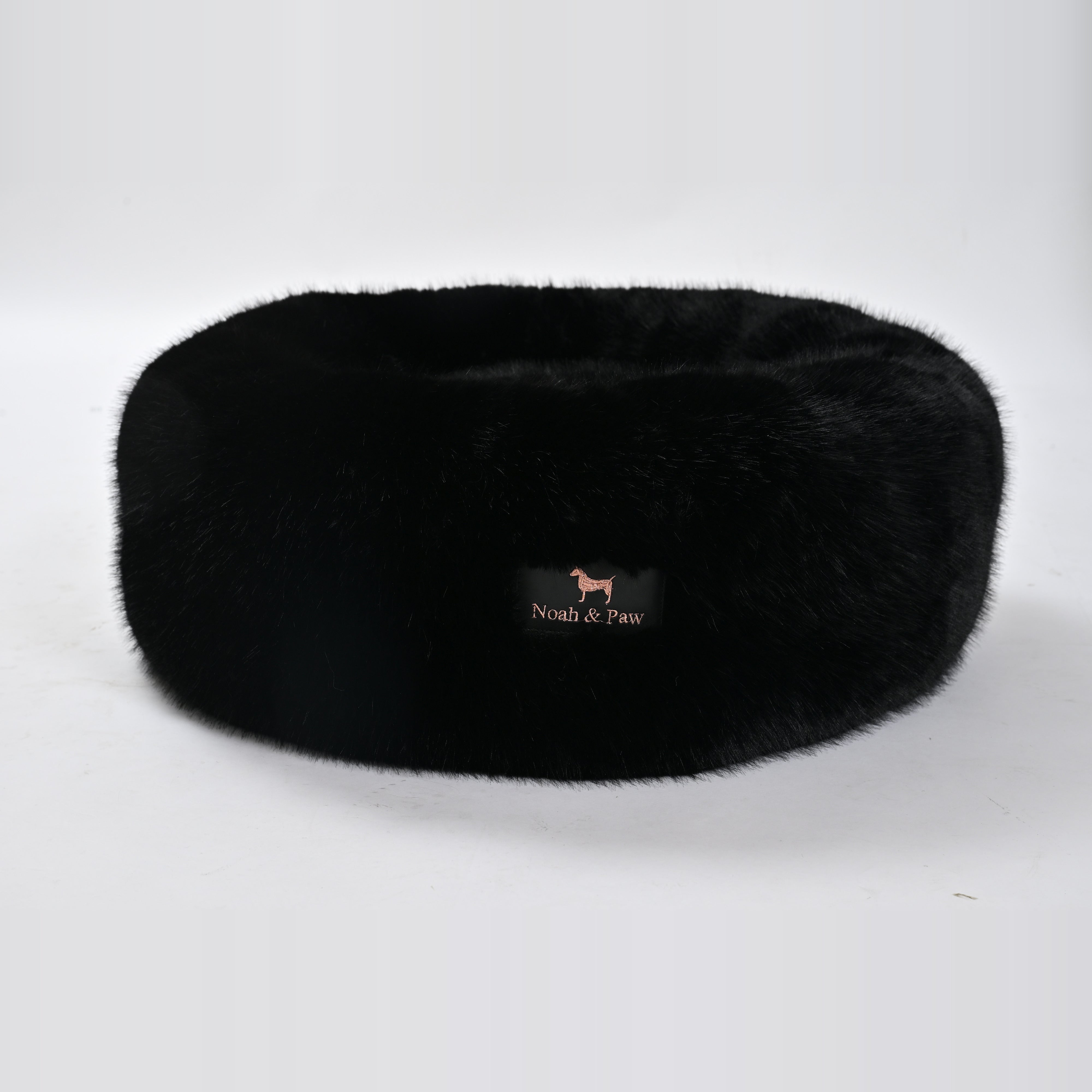 Black donut dog bed side view