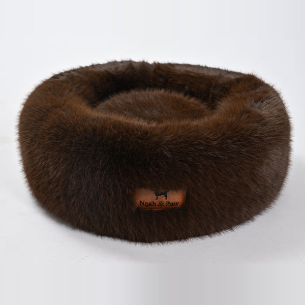 Brown donut dog bed side view