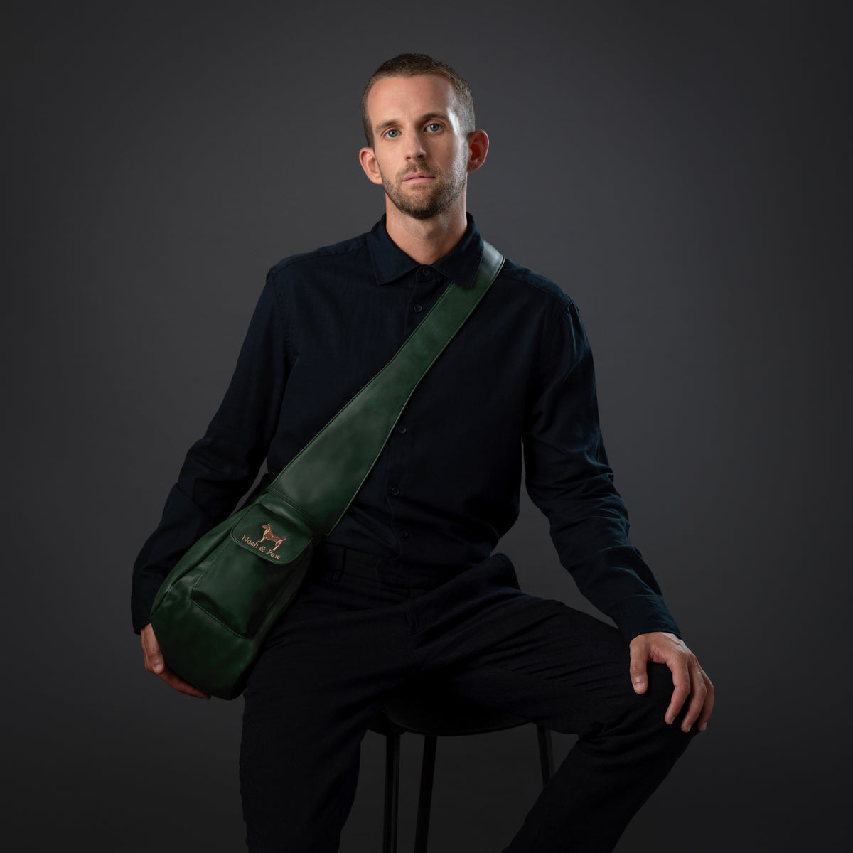 Noah & Paw ruffle style dog sling carrier in vegan leather, dark green