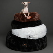 Dogs in Noah & Paw black and white and brown faux fur donut beds